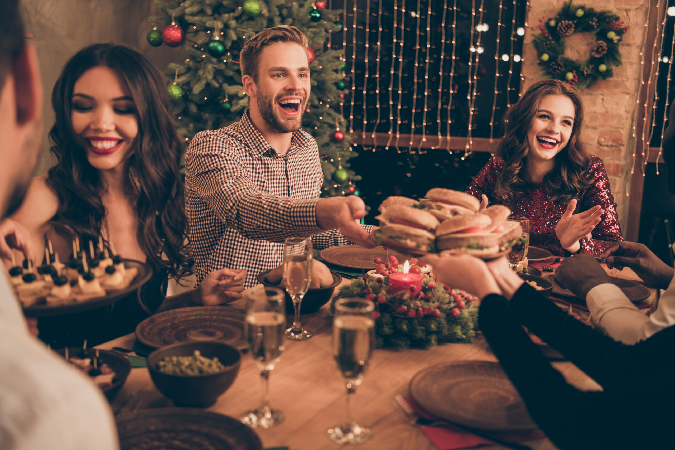 Attractive lovely smart stylish cheerful cheery glad positive friendly, guys having fun sitting sharing meal snack festal mood great occasion celebratory night in house indoors