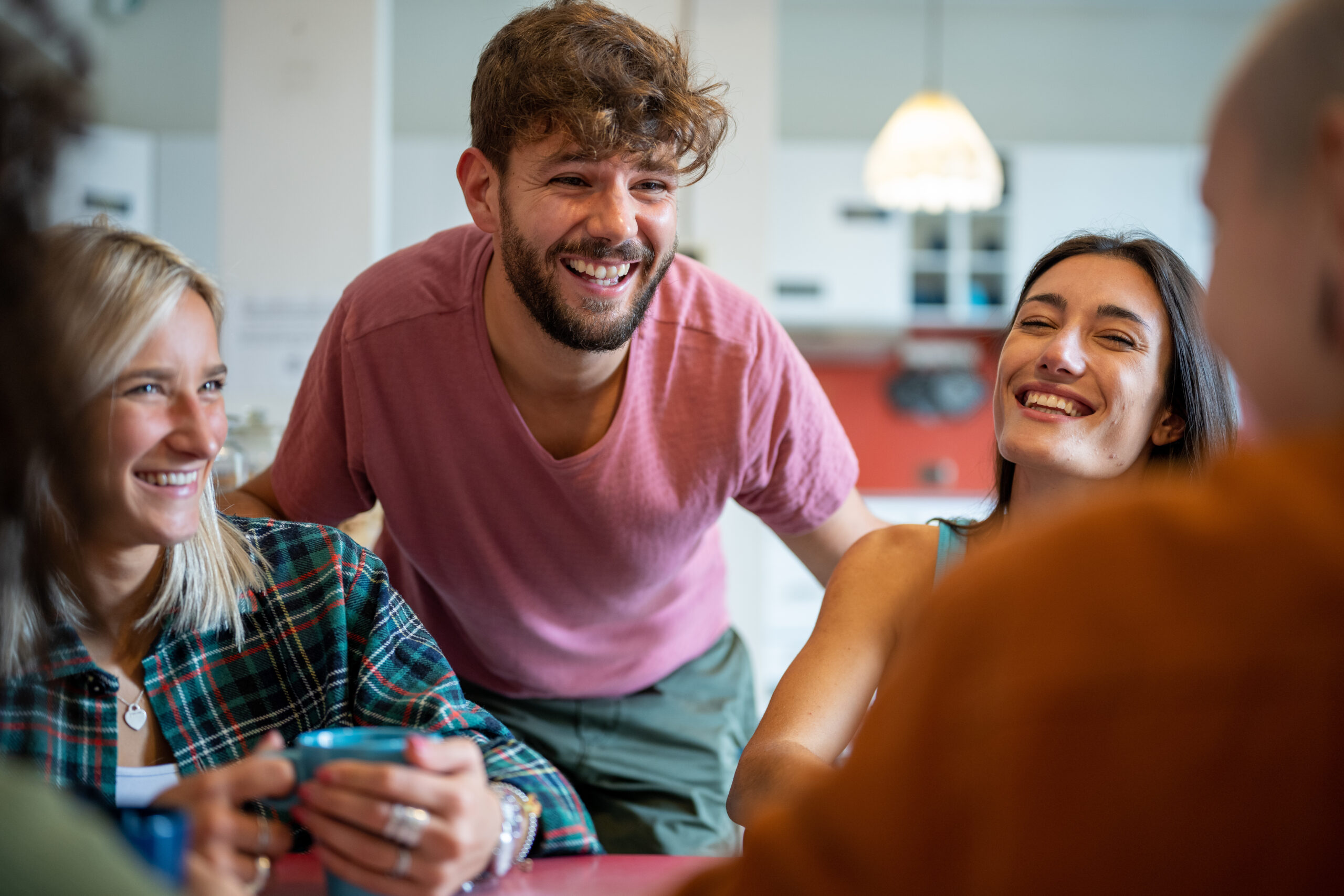 young people having fun in hostel living room, young travelers lifestyle